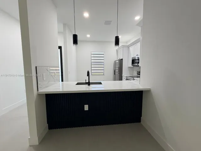 a room with two sink and a mirror