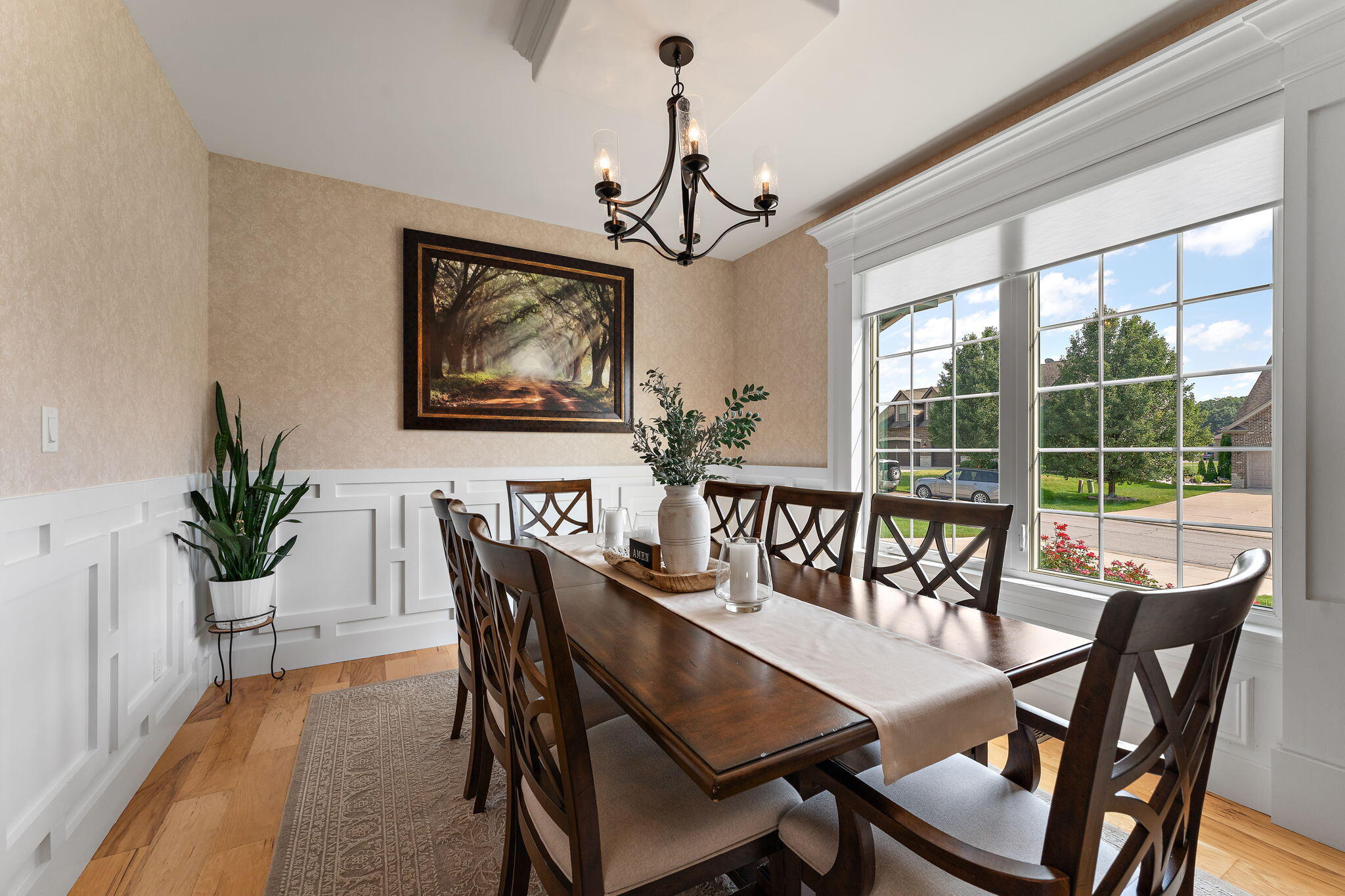 9192 Michigan Drive Crown Point, IN 46307 - Photo 11 of 66 a dining room with furniture potted plants and wooden floor