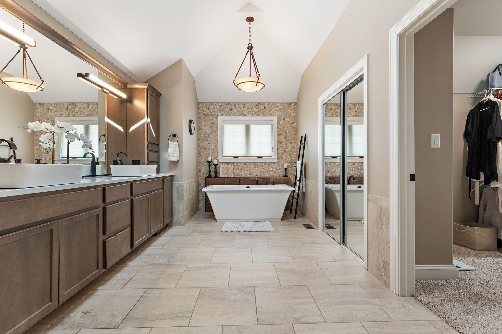 9192 Michigan Drive Crown Point, IN 46307 - Photo 41 of 66 a spacious bathroom with a mirror sink and toilet