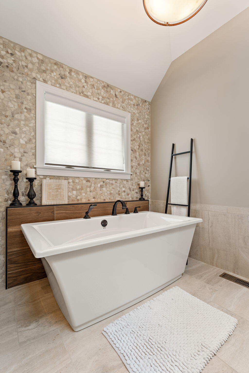 9192 Michigan Drive Crown Point, IN 46307 - Photo 43 of 66 a bath tub sitting in a bathroom next to a window