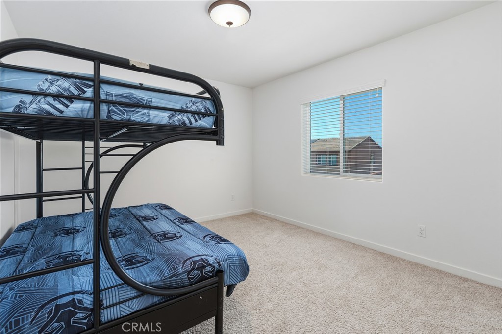 34727 Ribbon Grass Way Murrieta, CA 92563 - Photo 18 of 54 Secondary upstairs bedroom #2 with ample natural light