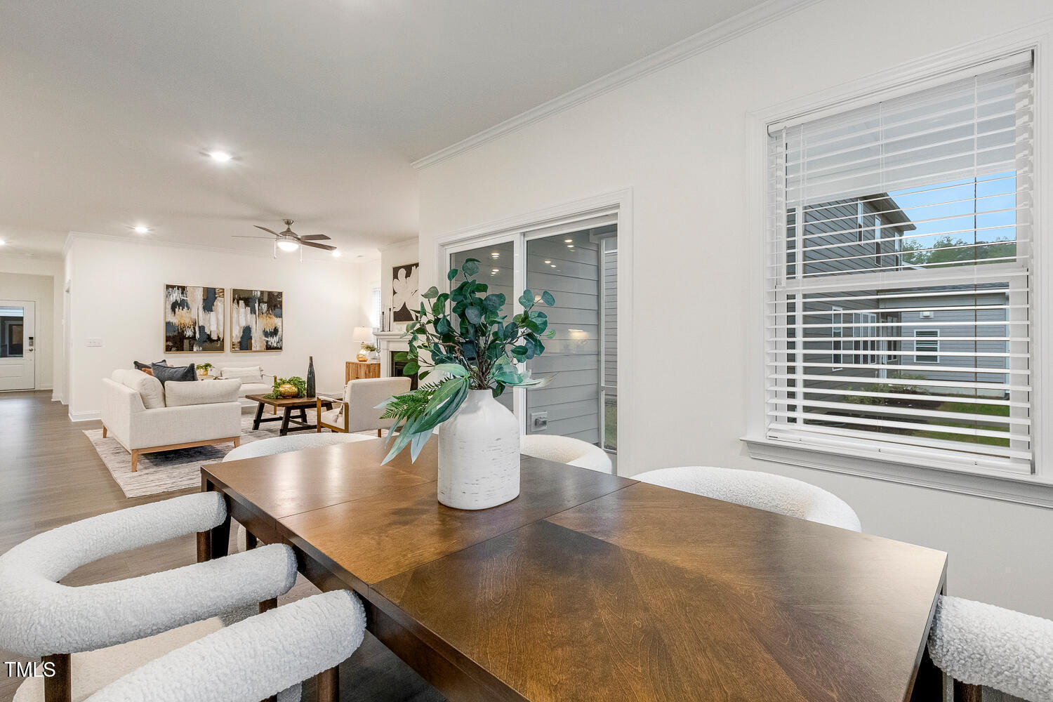 1116 Ciandra Barn Way Apex, NC 27523 - Photo 12 of 59 a dining room with furniture and wooden floor