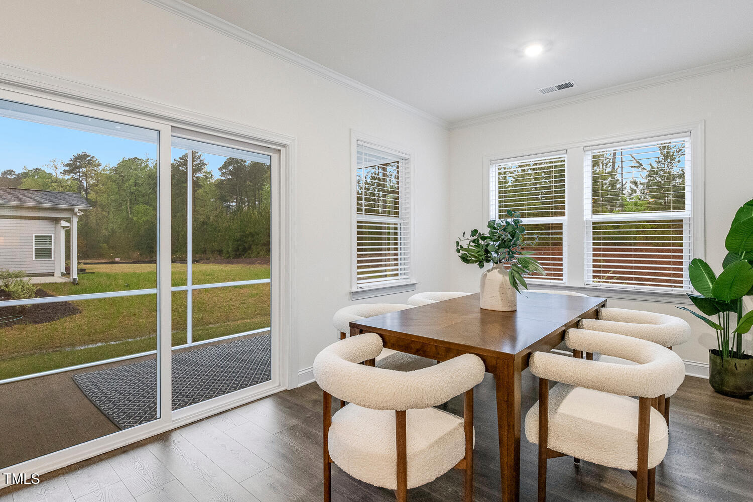 1116 Ciandra Barn Way Apex, NC 27523 - Photo 13 of 59 a dining room with furniture and window