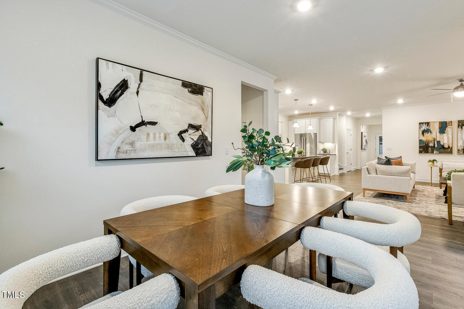 1116 Ciandra Barn Way Apex, NC 27523 - Photo 14 of 59 a dining room with furniture and wooden floor