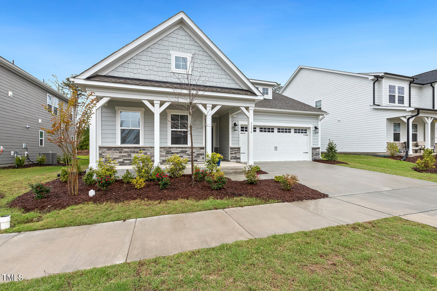 1116 Ciandra Barn Way Apex, NC 27523 - Photo 2 of 59 a front view of a house with a garden