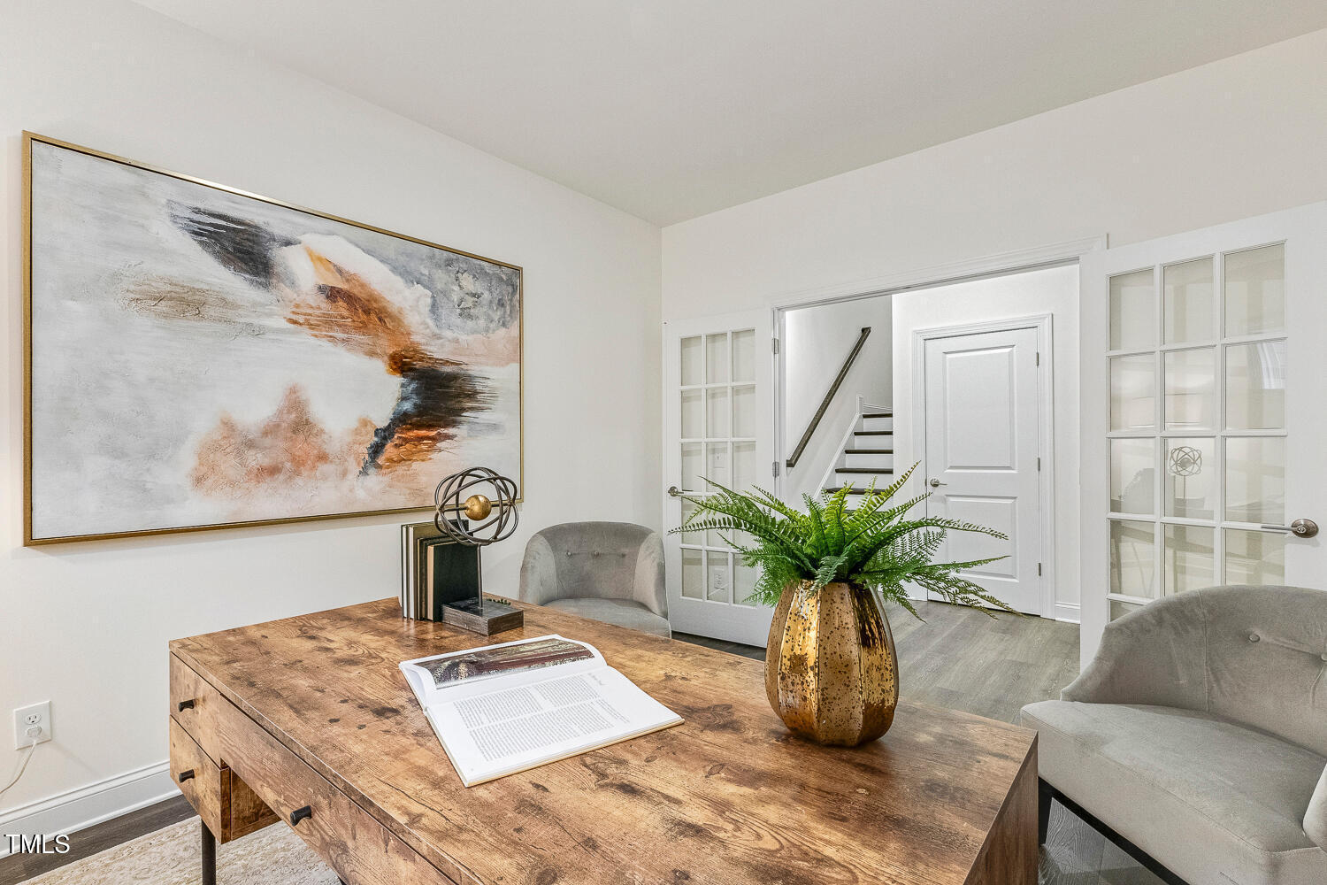 1116 Ciandra Barn Way Apex, NC 27523 - Photo 24 of 59 a table with a couch and a potted plant