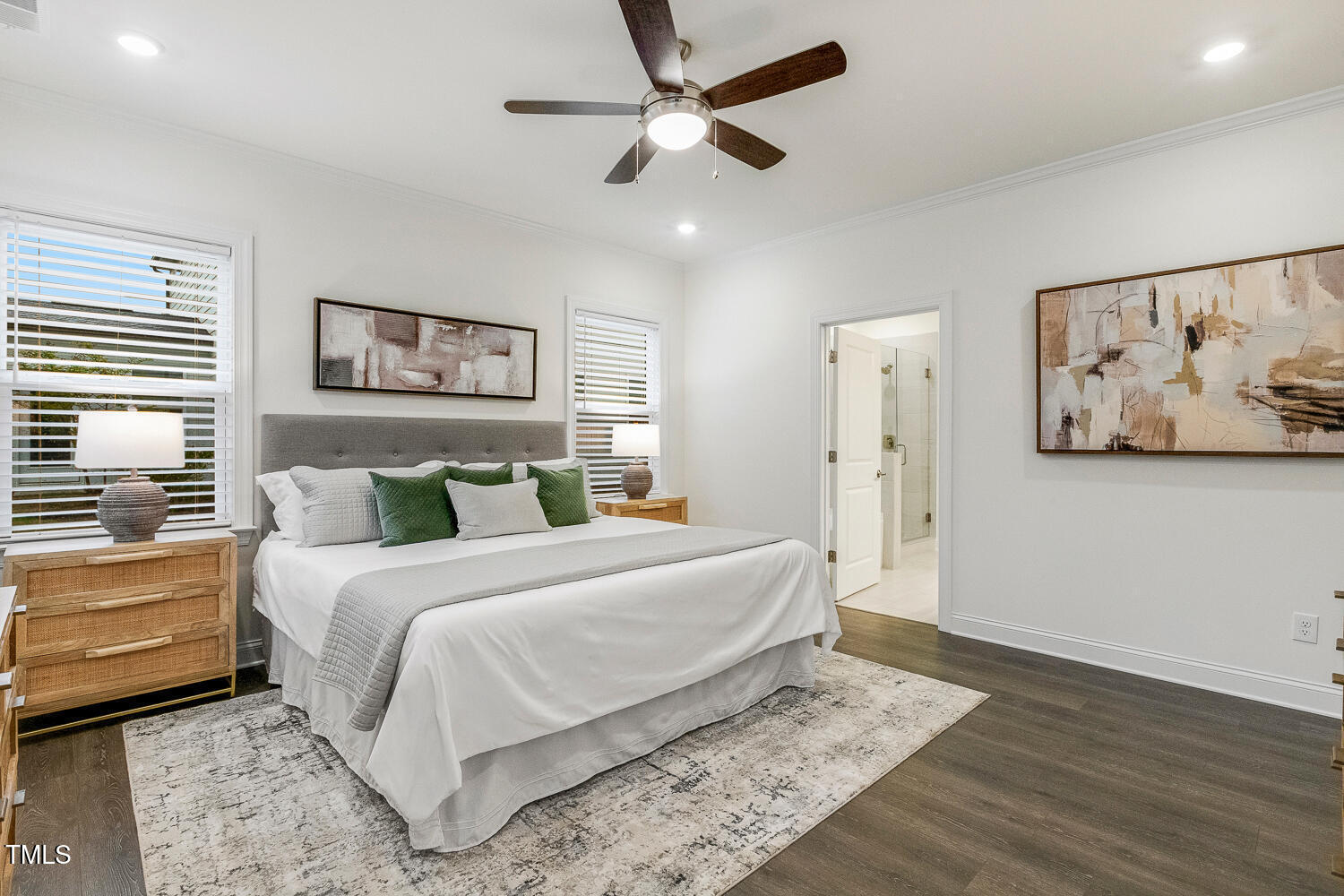 1116 Ciandra Barn Way Apex, NC 27523 - Photo 26 of 59 a bedroom with a large bed and a chandelier