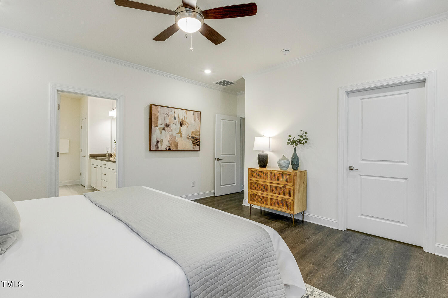 1116 Ciandra Barn Way Apex, NC 27523 - Photo 27 of 59 a bedroom with a bed and wooden floor