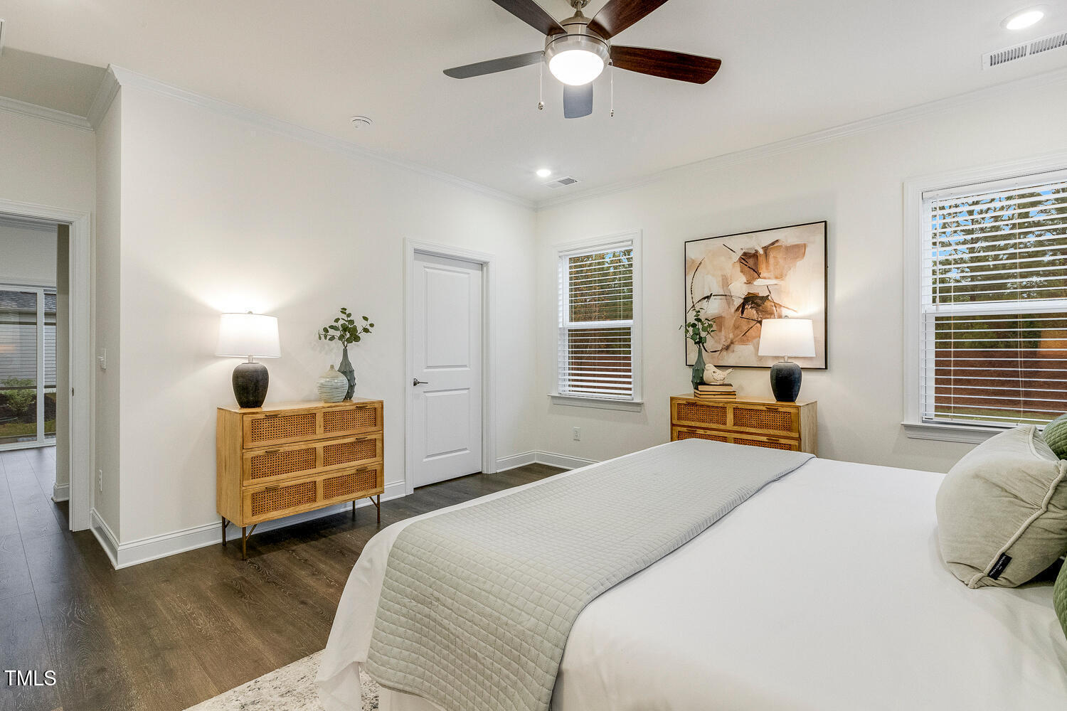 1116 Ciandra Barn Way Apex, NC 27523 - Photo 28 of 59 a bedroom with a bed and wooden floor