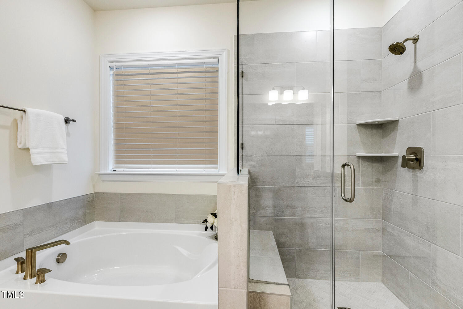 1116 Ciandra Barn Way Apex, NC 27523 - Photo 31 of 59 a bathroom with a bathtub