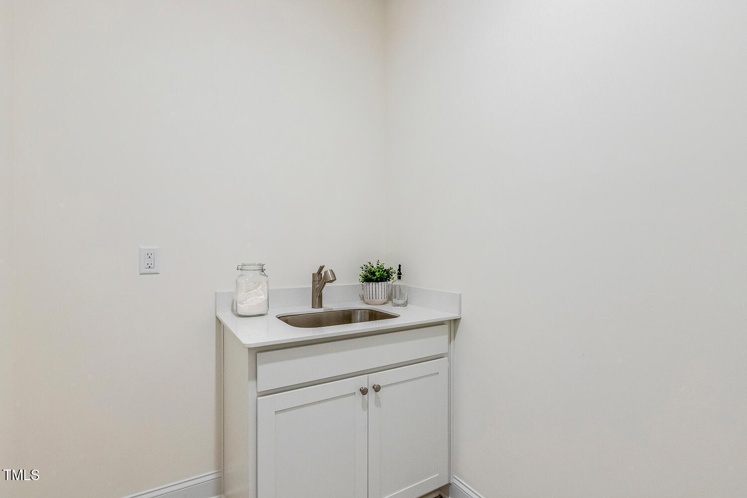 1116 Ciandra Barn Way Apex, NC 27523 - Photo 36 of 59 a bathroom with a sink and vanity