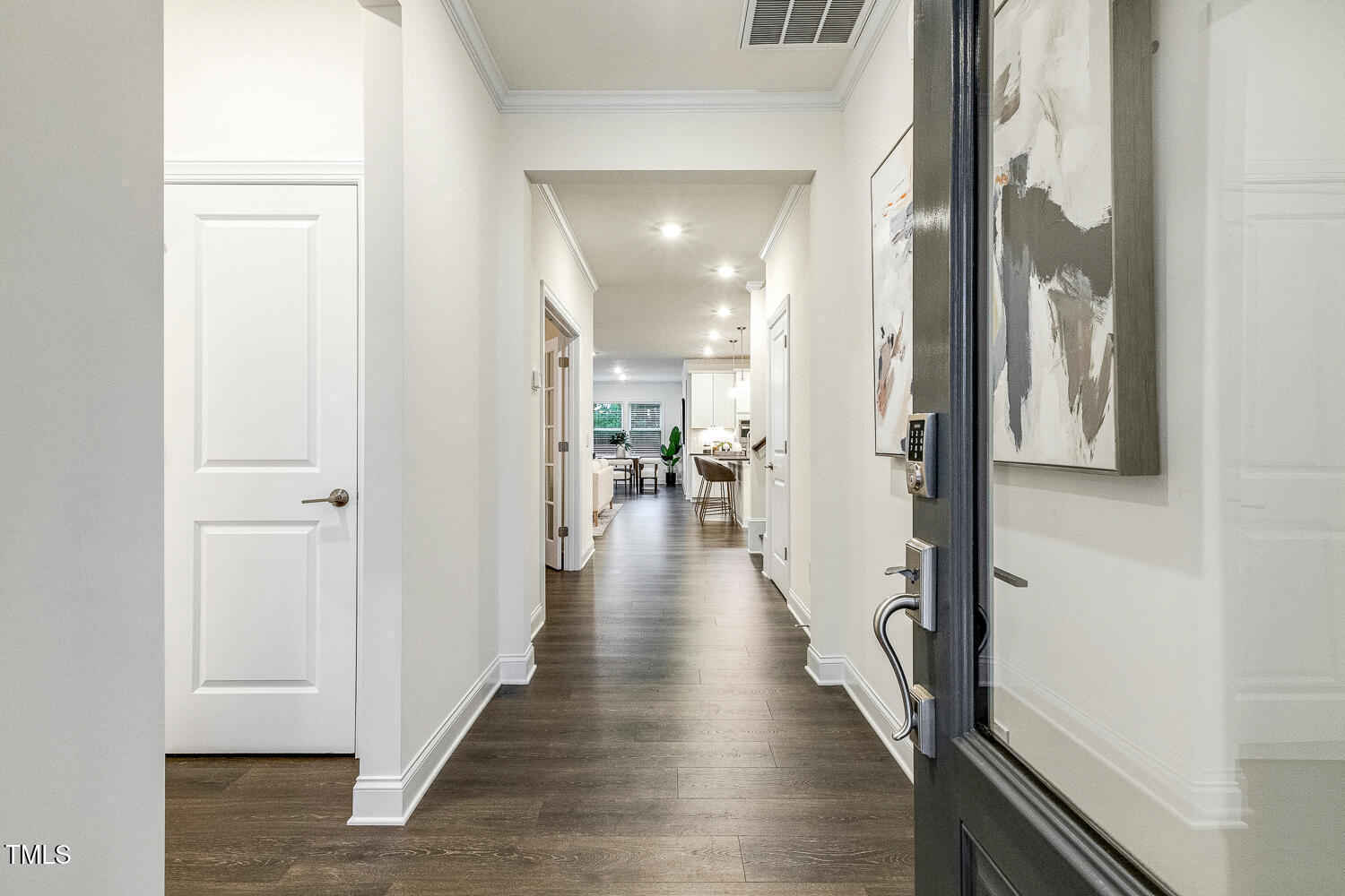 1116 Ciandra Barn Way Apex, NC 27523 - Photo 4 of 59 a view of a hallway with wooden floor and staircase