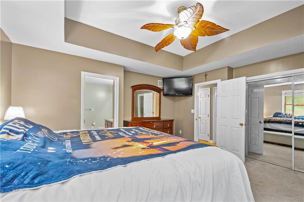 314 Glade Run Road Renfrew, PA 16053 - Photo 14 of 24 a bedroom with a bed and a chandelier