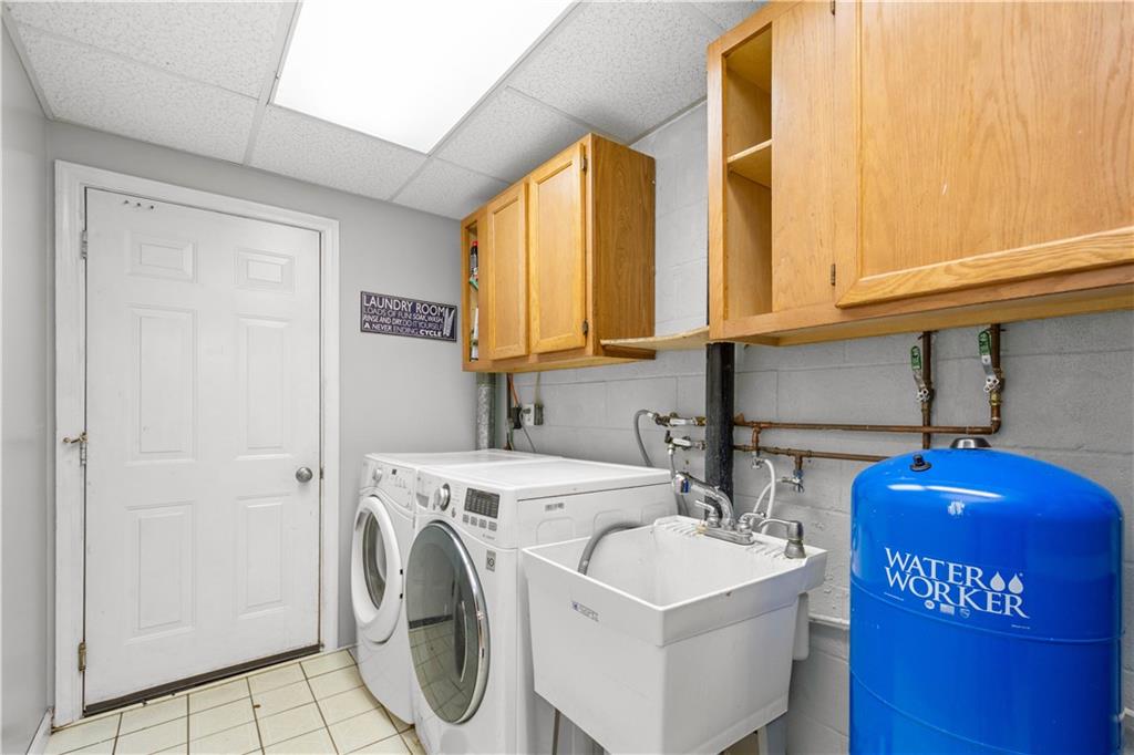 314 Glade Run Road Renfrew, PA 16053 - Photo 19 of 24 a bathroom with a sink a washer and dryer
