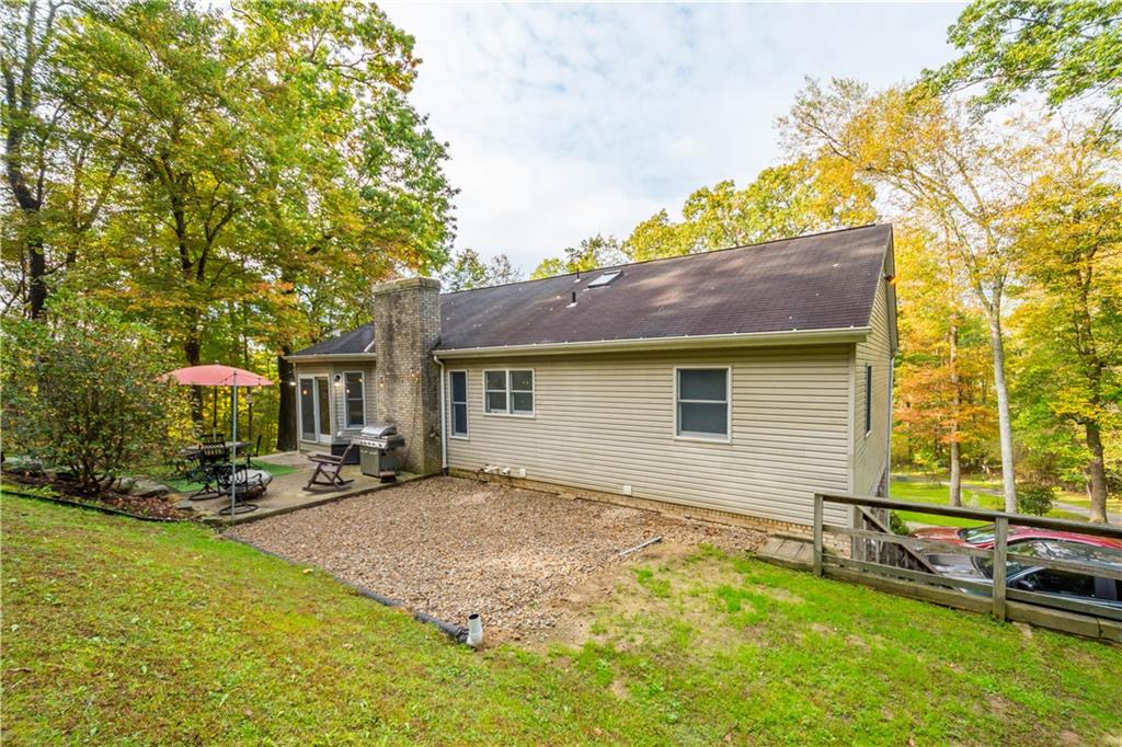 314 Glade Run Road Renfrew, PA 16053 - Photo 23 of 24 a backyard of a house with table and chairs