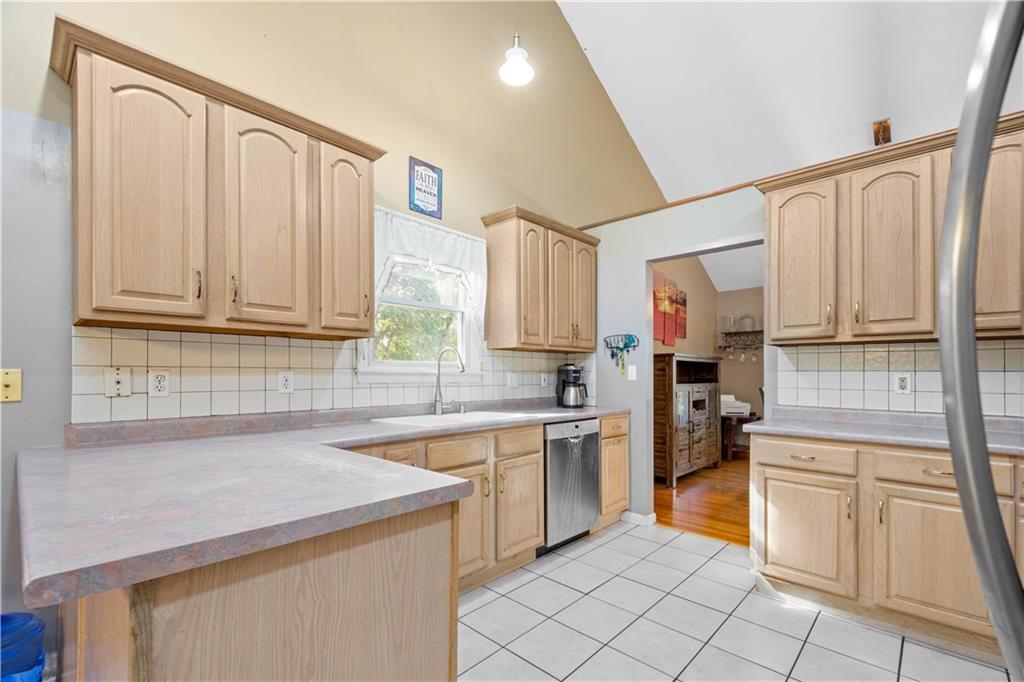 314 Glade Run Road Renfrew, PA 16053 - Photo 8 of 24 a kitchen with a sink stove and cabinets