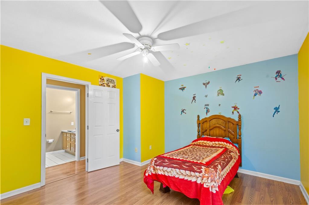 314 Glade Run Road Renfrew, PA 16053 - Photo 10 of 24 a bedroom with a bed and wooden floor