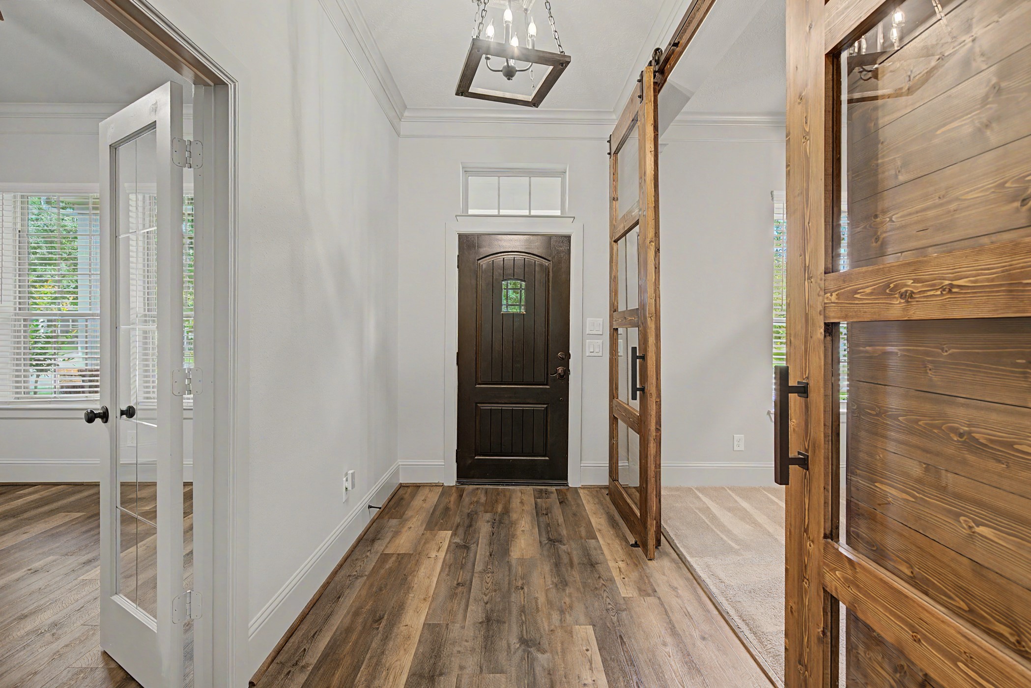 31032 Sunfall Trail Lane Spring, TX 77386 - Photo 3 of 39 a view of a hallway with wooden floor and staircase