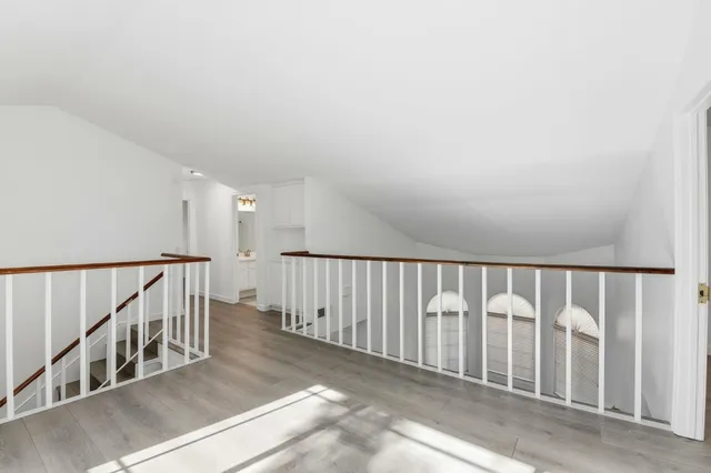 a view of staircase with lots of white walls