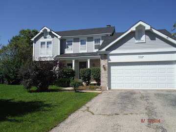 107 Country Court Bolingbrook, IL 60440 - Photo 1 of 13 a front view of a house with a yard and garage