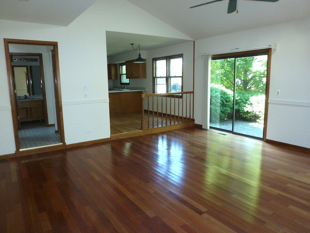 107 Country Court Bolingbrook, IL 60440 - Photo 9 of 13 a view of empty room with wooden floor and fan