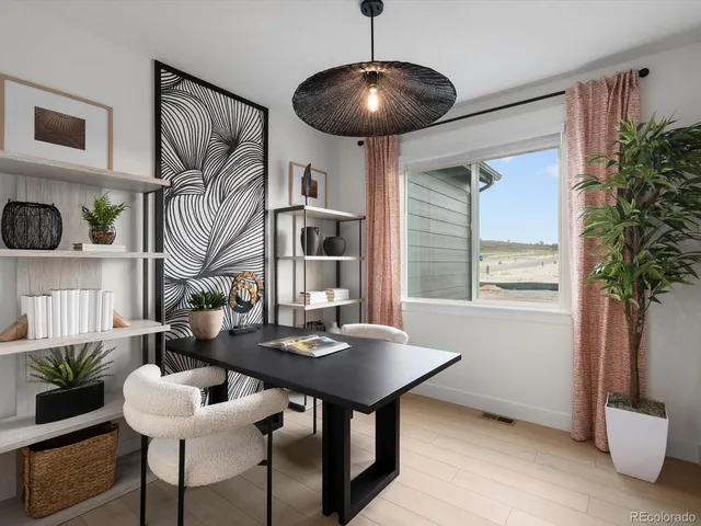 a view of a livingroom with furniture and window