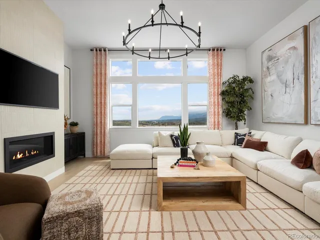 a living room with furniture fireplace and flat screen tv