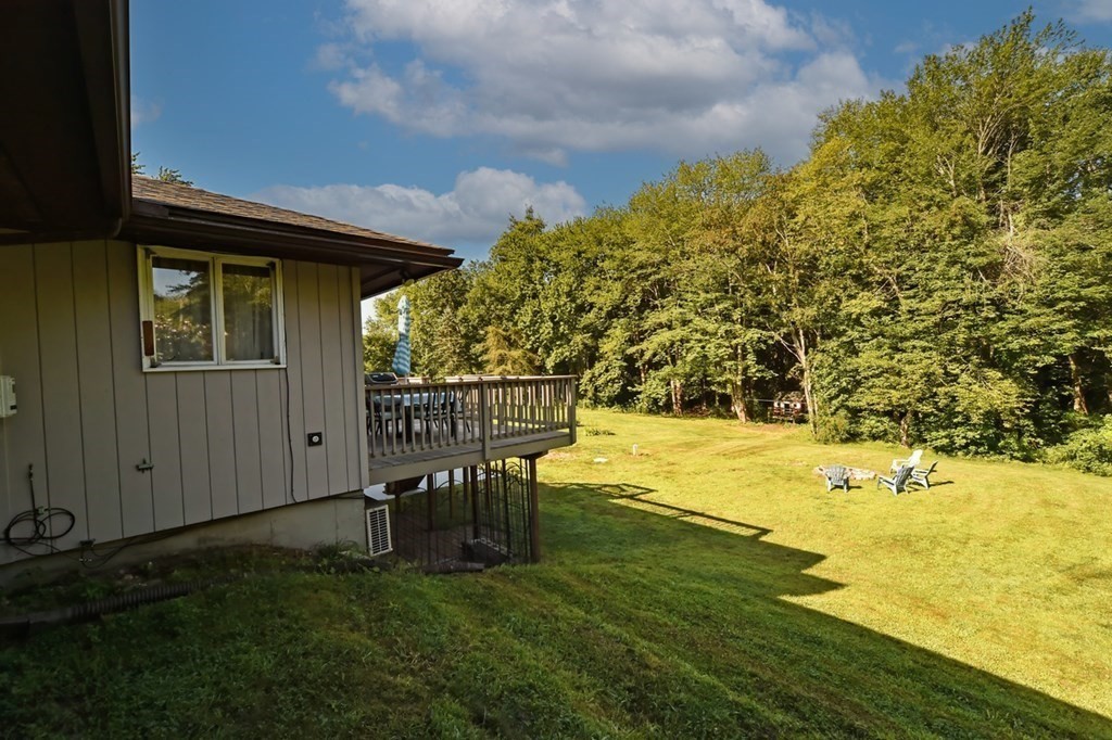 116 Middle Road Southampton, MA 01073 - Photo 31 of 31 a view of a pathway of a house with lawn chairs and wooden fence