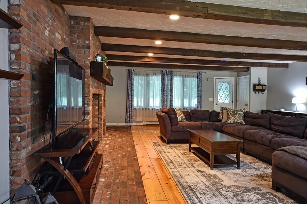 116 Middle Road Southampton, MA 01073 - Photo 8 of 31 a living room with furniture and a fireplace