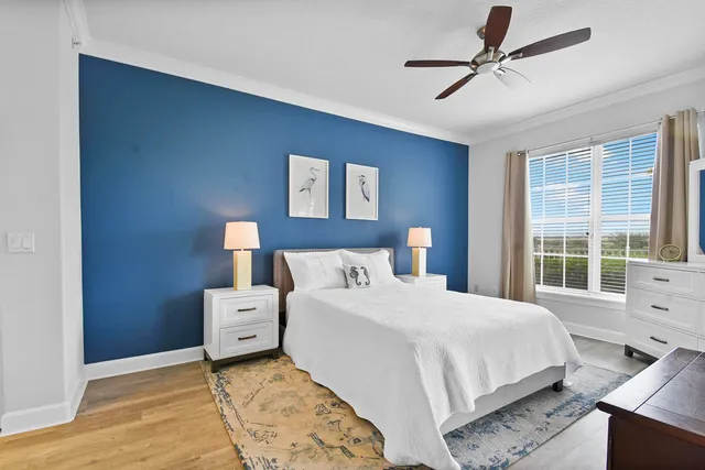 a bedroom with a large bed and a window