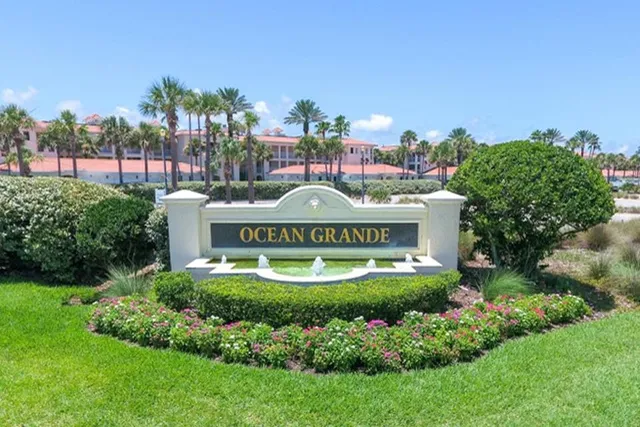 a view of a multi story building with a yard