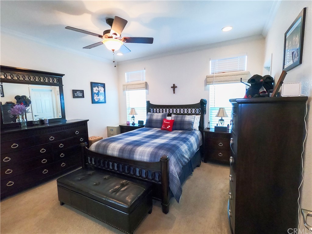 1051 Site Drive, Unit 286 Brea, CA 92821 - Photo 12 of 25 a bedroom with a bed and a dresser