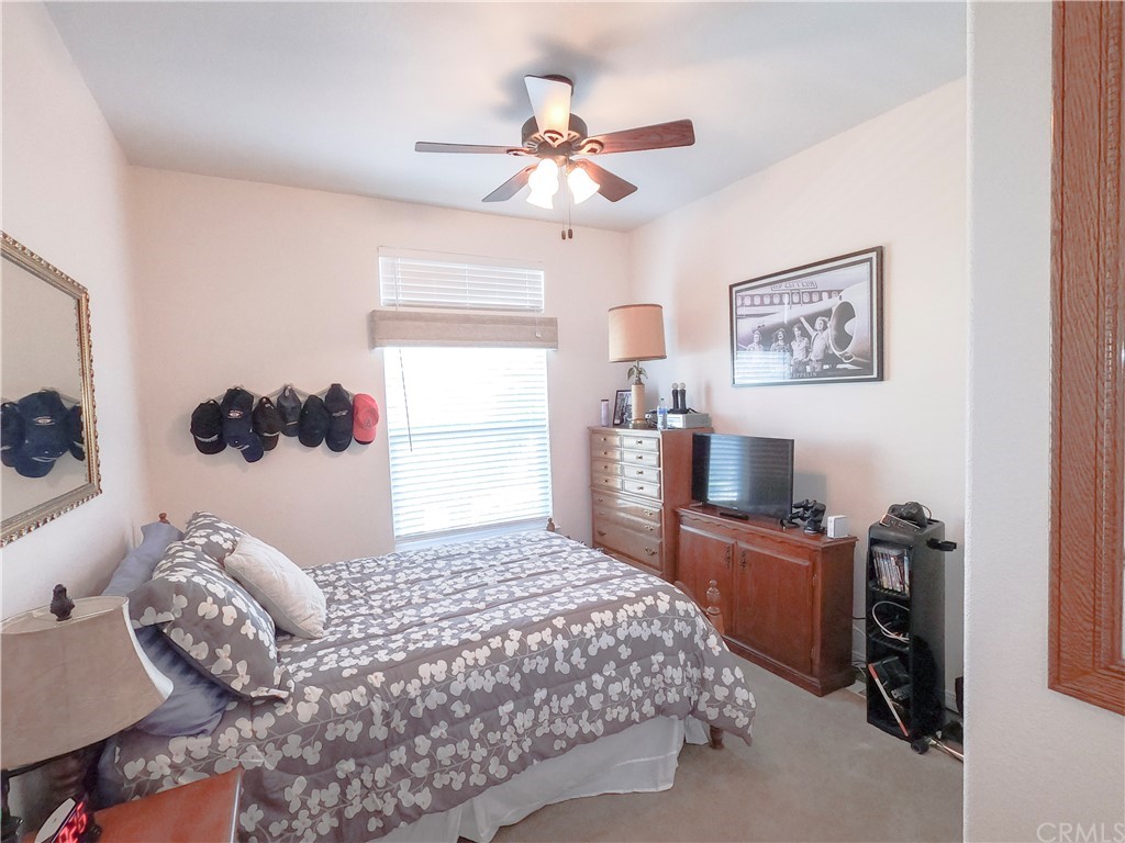 1051 Site Drive, Unit 286 Brea, CA 92821 - Photo 18 of 25 a bedroom with a large bed and a window