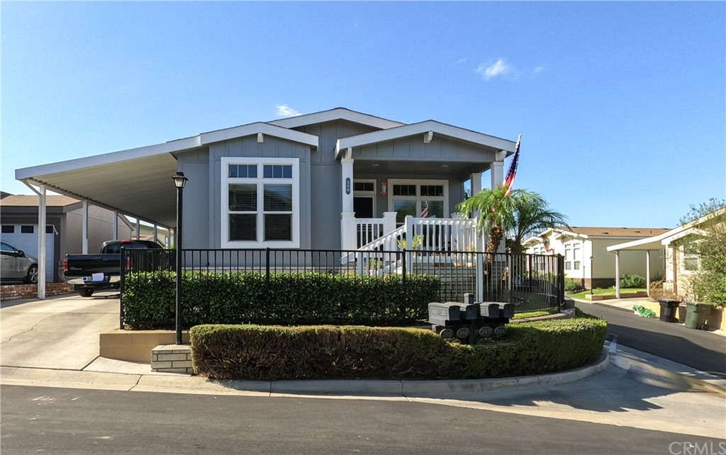 1051 Site Drive, Unit 286 Brea, CA 92821 - Photo 23 of 25 a front view of a house with a yard