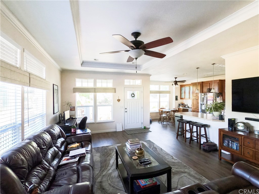 1051 Site Drive, Unit 286 Brea, CA 92821 - Photo 4 of 25 a living room with furniture a flat screen tv and a large window