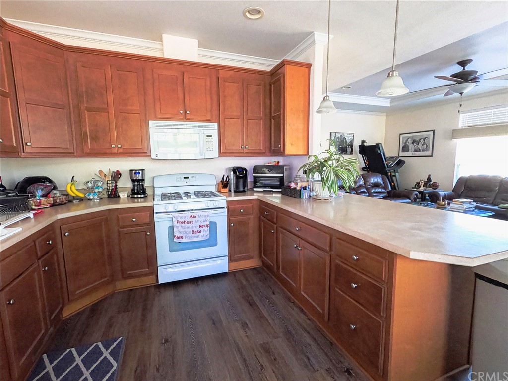 1051 Site Drive, Unit 286 Brea, CA 92821 - Photo 6 of 25 a kitchen with stainless steel appliances sink a stove and cabinets