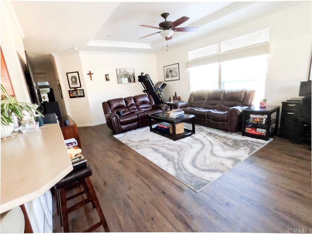 1051 Site Drive, Unit 286 Brea, CA 92821 - Photo 9 of 25 a living room with furniture window and a flat screen tv