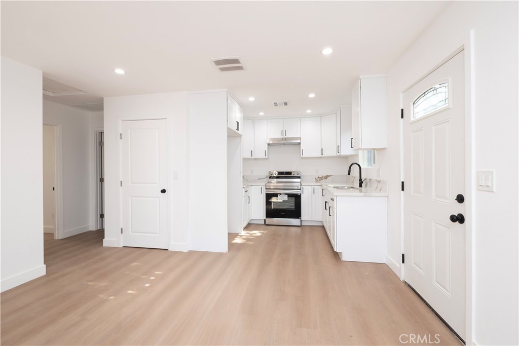 5741 South St Andrews Place, Unit 1/2 Los Angeles, CA 90062 - Photo 15 of 28 a view of kitchen with wooden floor