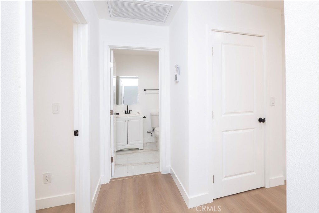 5741 South St Andrews Place, Unit 1/2 Los Angeles, CA 90062 - Photo 20 of 28 a view of a bathroom from a hallway