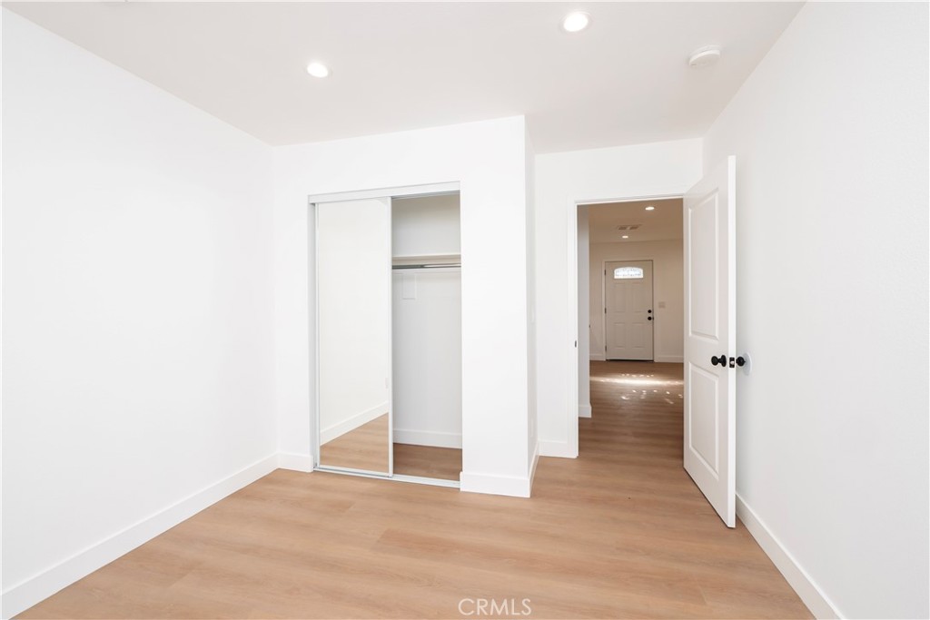 5741 South St Andrews Place, Unit 1/2 Los Angeles, CA 90062 - Photo 24 of 28 a view of a hallway with wooden floor