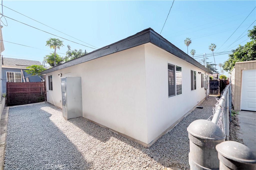 5741 South St Andrews Place, Unit 1/2 Los Angeles, CA 90062 - Photo 28 of 28 a view of a house with backyard and sitting area