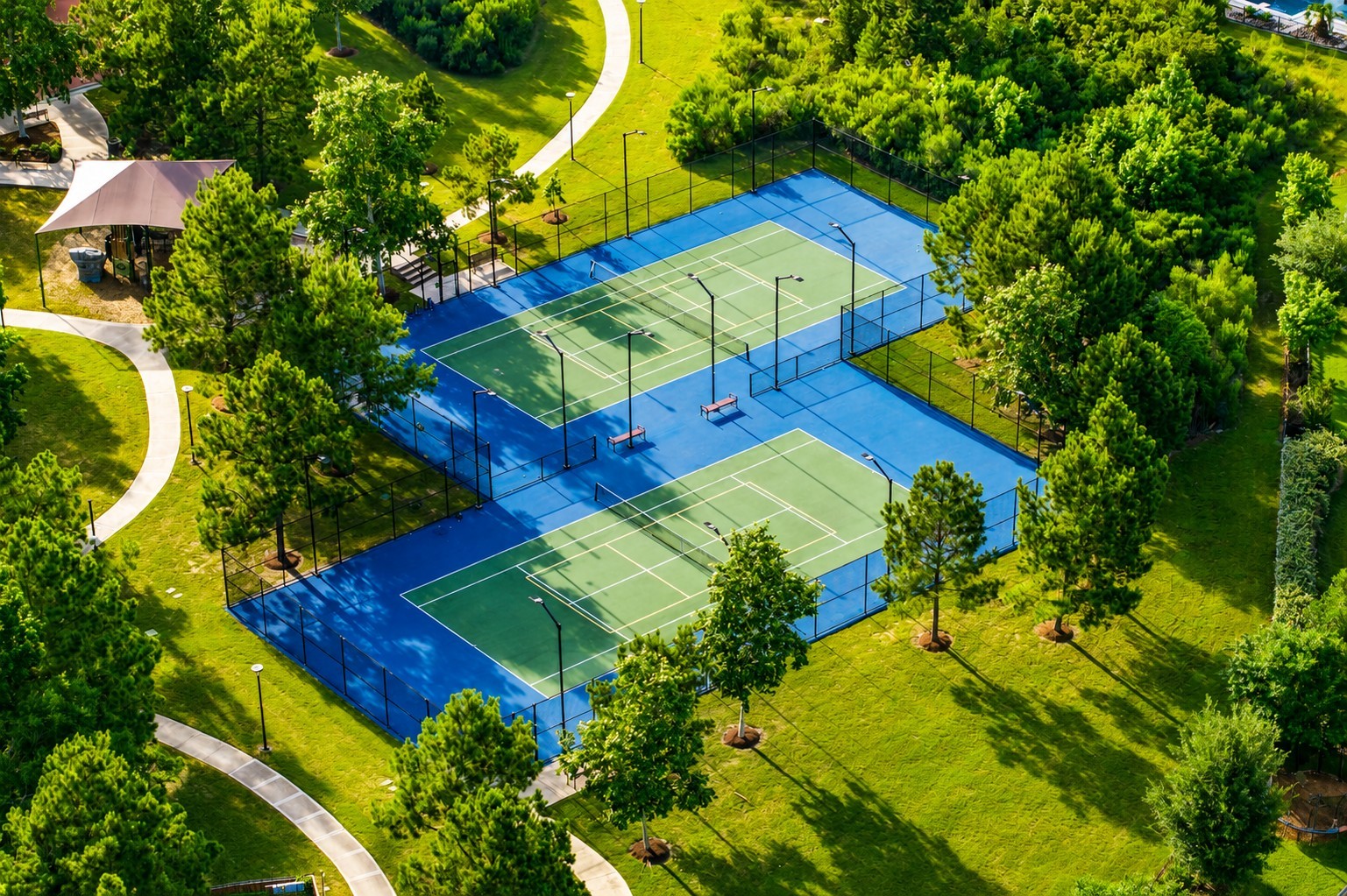 3622 Sage Hollow Drive Spring, TX 77386 - Photo 42 of 46 Enjoy access to community tennis courts surrounded by scenic green space, walking trails, and mature trees—one of the many recreational amenities available to residents. Whether you're meeting neighbors for a match or enjoying an active afternoon outdoors, this thoughtfully designed amenity adds to the lifestyle that makes this community so desirable.