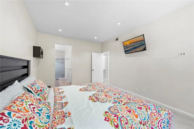 a bedroom with bed and a window