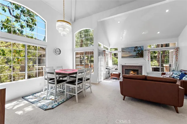 a living room with furniture fireplace and window