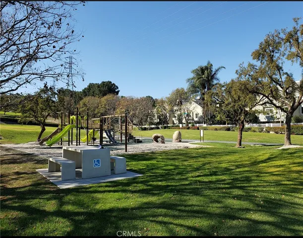 a view of a park with swings and slides