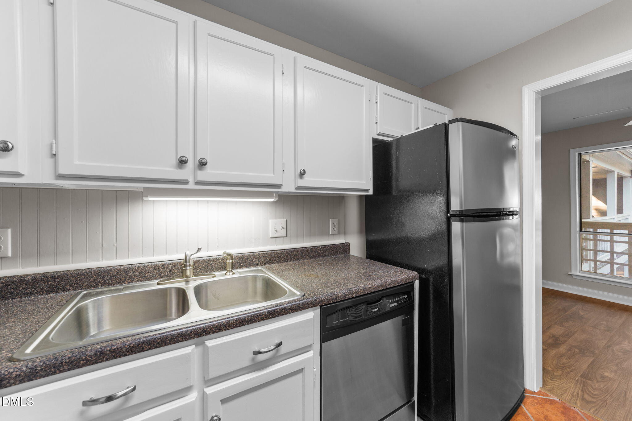 4110 Sedgewood Drive, Unit 302 Raleigh, NC 27612 - Photo 13 of 38 a kitchen with stainless steel appliances granite countertop a refrigerator and a sink