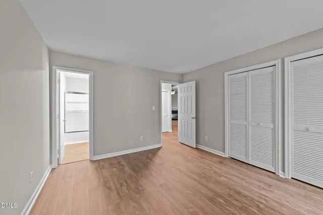 a bathroom with a toilet a sink and a mirror