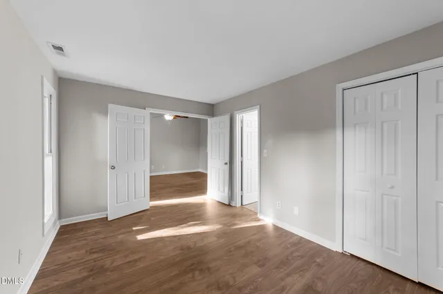 a view of hallway with wooden floor