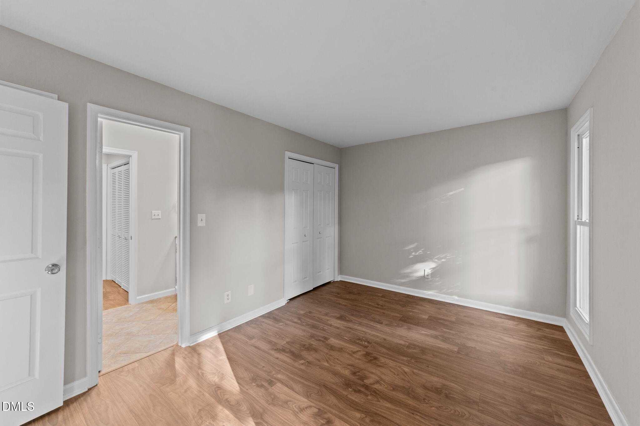 4110 Sedgewood Drive, Unit 302 Raleigh, NC 27612 - Photo 22 of 38 a view of wooden floor and windows in a room
