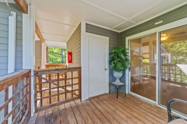 a view of balcony with wooden floor
